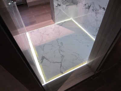 Santarossa 1 Truly a "sneak peek", this custom marble shower with built in shelving has an LED lit floor and ceiling and infiniti drain.