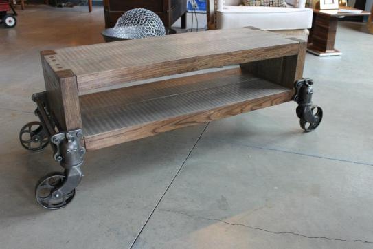 Poplar and oak coffee table with antique casters from factory carts.