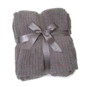 Cuddle up this winter with a Barefoot Dreams throw blanket. Available from H Curated.