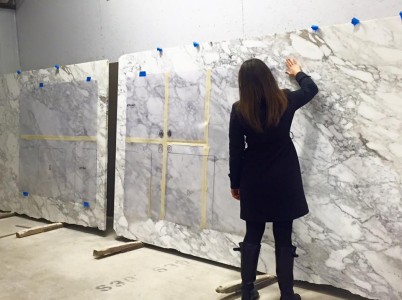Interior Design and principal for MAWR Design, Whittney Parkinson, inspects the slabs.