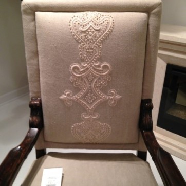 A beautifully emobroidered seat back provides an eye-catching look.