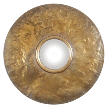 A convex mirror surrounded by a hammered metal frame in an oxidized metal revealing a soft gold finish.