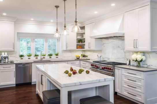 Multiple prep and cooking zones allow for the whole family to participate in meal preparation. Kitchen design by Conceptual Kitchens & Millwork.